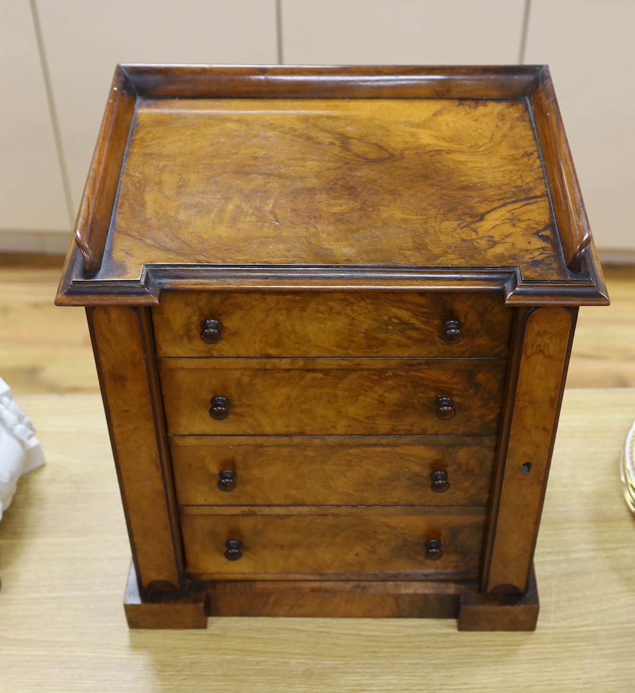 A Victorian figured walnut table top Wellington collector’s chest, 51 cms high x 43 cms wide